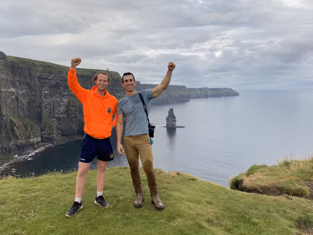 Ollie on cliff with a tourist