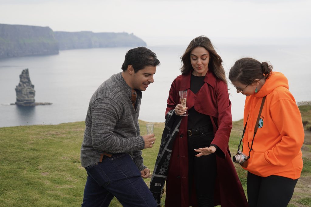 46-STP01327 Fiancee showing engagement ring to tour guide