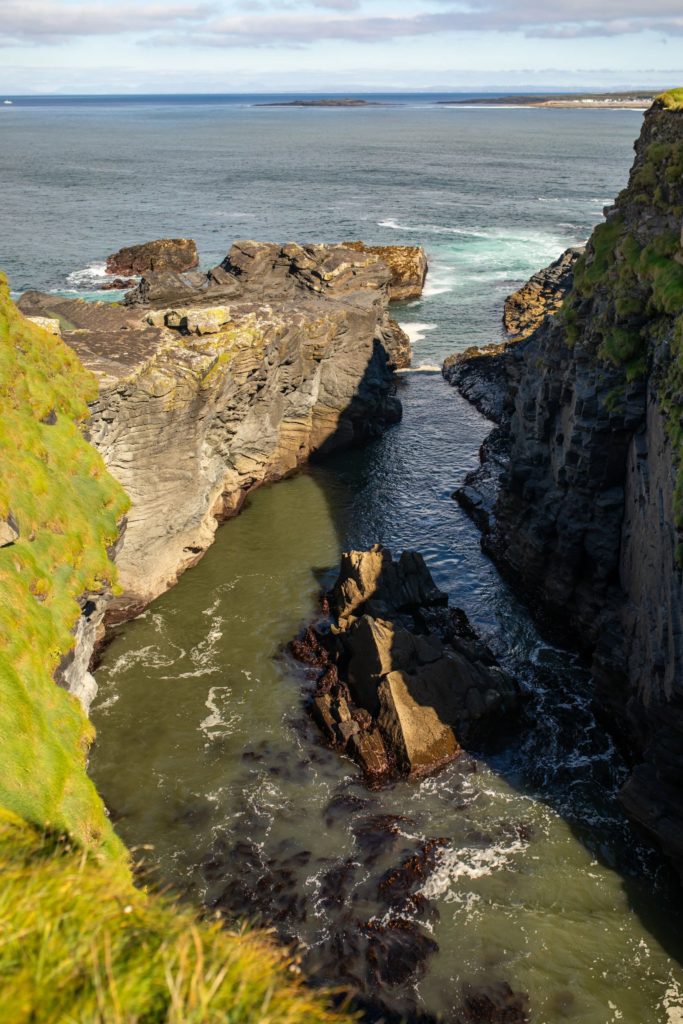 AKphoto (78) Dramatic Irish coastline with rugged cliffs and Atlantic Ocean view under a bright sky.